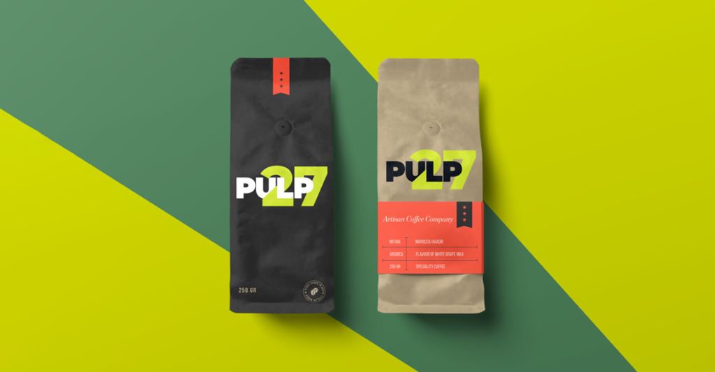 Two coffee bags (one black, one brown) with Pulp 27 branding on them shown on a green background
