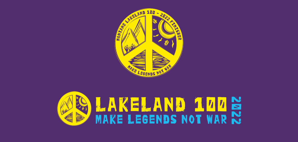 Peace symbol Lakeland 100 Logo in yellow on a purple background. Features mountains in upper left section, sunshine in upper right and lakes in lower sections. The text reads Lakeland 100 2022 Make Legends Not War.