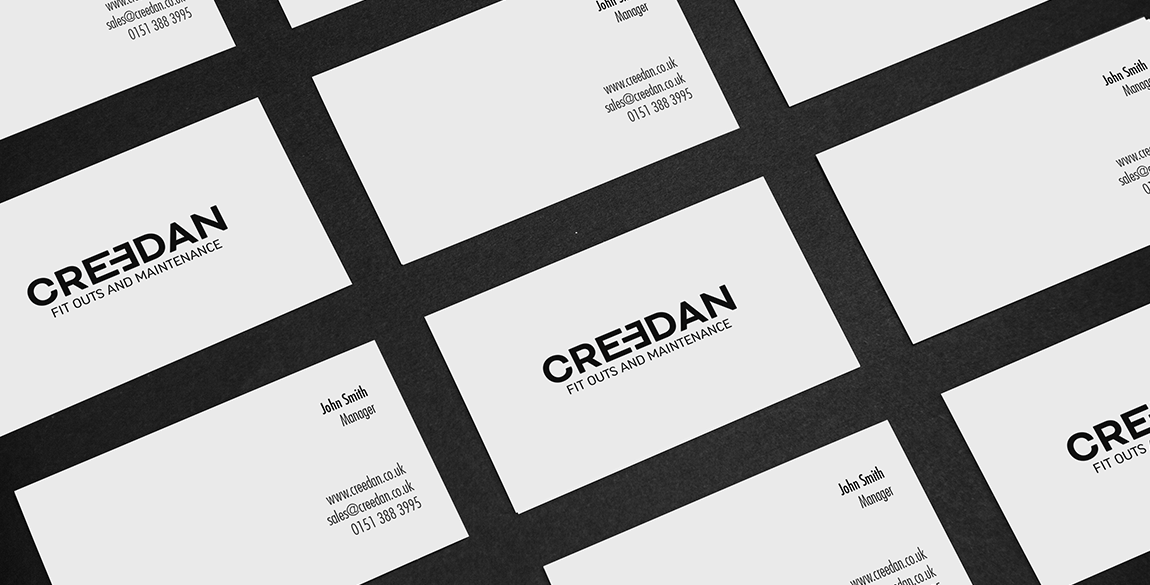 Business cards showing creedan logo in black on white background